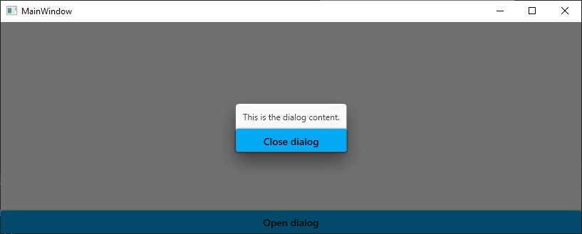 A window with a button to open a dialog and a dialog on top of it with a text and a button to close it. The window content is grayed out.